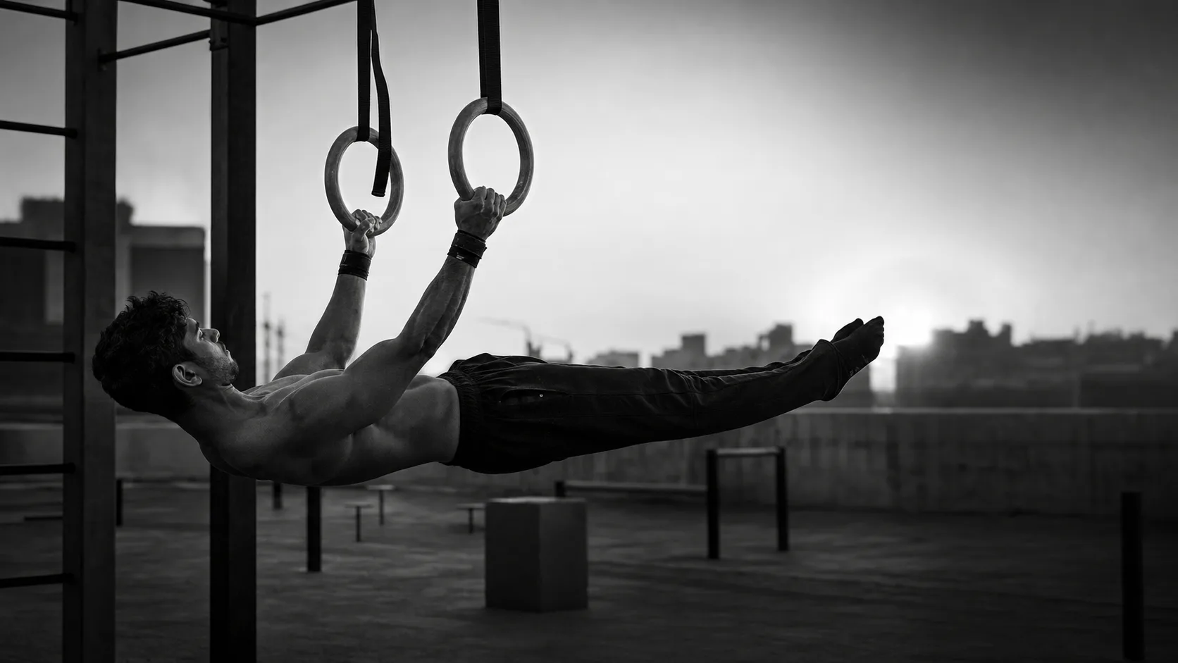 Editorial placeholder of an athlete holding a front lever on rings